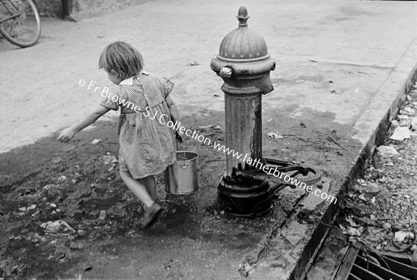 GIRL AT WATER PUMP